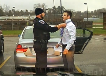 Dashcam: Police Officer Helps Speeding Student Tie His Tie