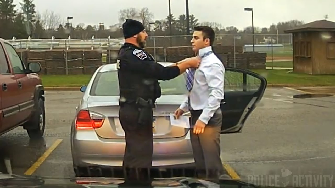 Dashcam: Police Officer Helps Speeding Student Tie His Tie